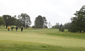 Twenty-eight teams braved cool, rainy weather during the four-person modified Texas scramble format tournament.   Tim Brody / Bulletin Photo