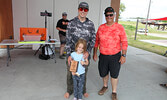 Brandon Kamm and Hayley Kamm accept their first prize trophy in the 10 and under category from Morgan Fuels President Darrell Morgan. Morgan Fuels was the title sponsor of the Jr. Walleye Championship.    Tim Brody / Bulletin Photo 