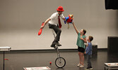 Tim Holland, along with his puppets Crackers the parrot and Julius  the turtle, delighted audience members, some of whom assisted him with his performance.   Tim Brody / Bulletin Photo