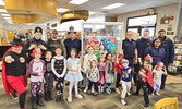 Sioux Lookout OPP, Sioux Lookout Fire Service, and SkyCare air ambulance pilots and paramedics were celebrated as local ‘superheroes’ last week at a Superhero Party at the Sioux Lookout Public Library.     Photo courtesy Sioux Lookout Public Library