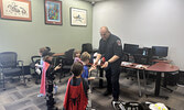 Sioux Lookout OPP, Sioux Lookout Fire Service, and SkyCare air ambulance pilots and paramedics were celebrated as local ‘superheroes’ last week at a Superhero Party at the Sioux Lookout Public Library.     Tim Brody / Bulletin Photo