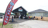 A BBQ and prize draw were part of the grand opening celebration for McFee’s Car Wash located on Wellington Street.     Tim Brody / Bulletin Photo