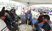 Ralph Johnson (seated centre) leads drummers during the powwow at the hospital grounds.    Tim Brody / Bulletin Photo 