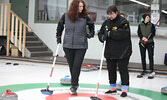 New curler Anita Webster (right) gets some tips from Michelle Diston (left).     Tim Brody / Bulletin Photo