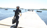 Karla Madsen makes her way to the weigh station at the Town Beach with her team’s catch.     Tim Brody / Bulletin Photo 