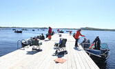 Anglers wait for their chance have their catches weighed.     Tim Brody / Bulletin Photo 